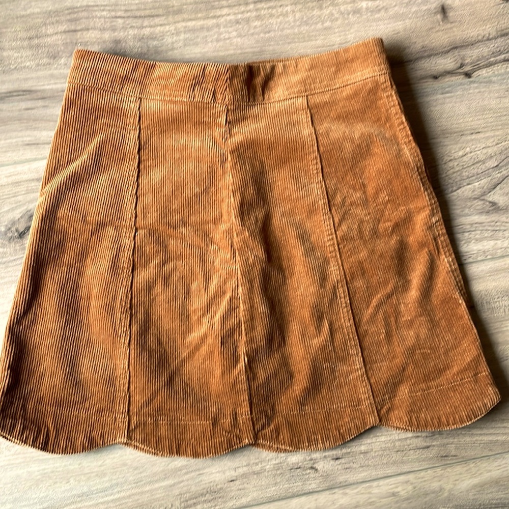 Adorable corduroy mini skirt. Brown/rust color.